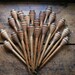 Vintage Set of Five Wooden Spools or Bobbins with brass fittings