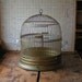 Vintage Round Brass Hendryx Birdcage with clear glass feeders