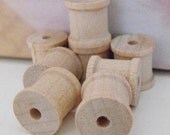 8 mini wooden spools