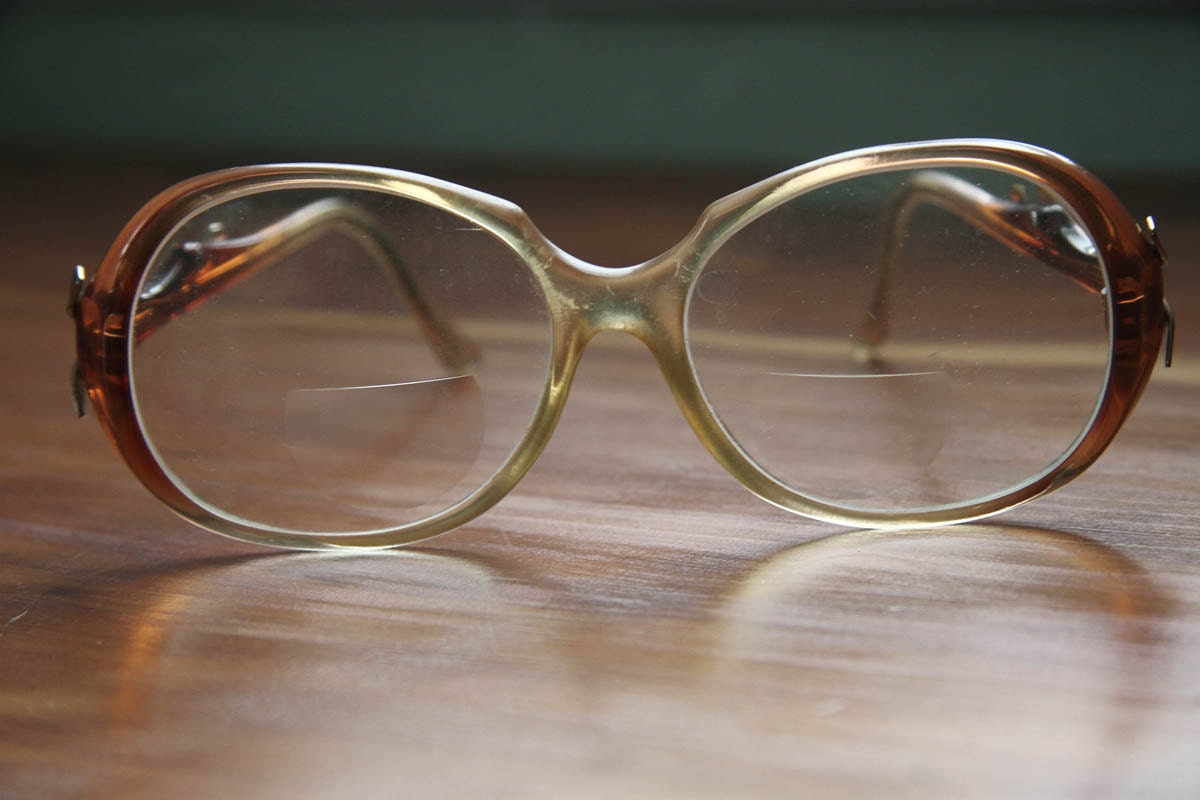 1980's neutral plastic glasses frames with gold accents.