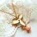 Petite Flower Necklace . gold flower and pink coral bead . gold filled