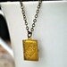 Necklace. Secret Story Book. Tiny brass locket on brass chain. By Vintette on Etsy.