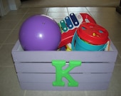 Child's toy box with letter