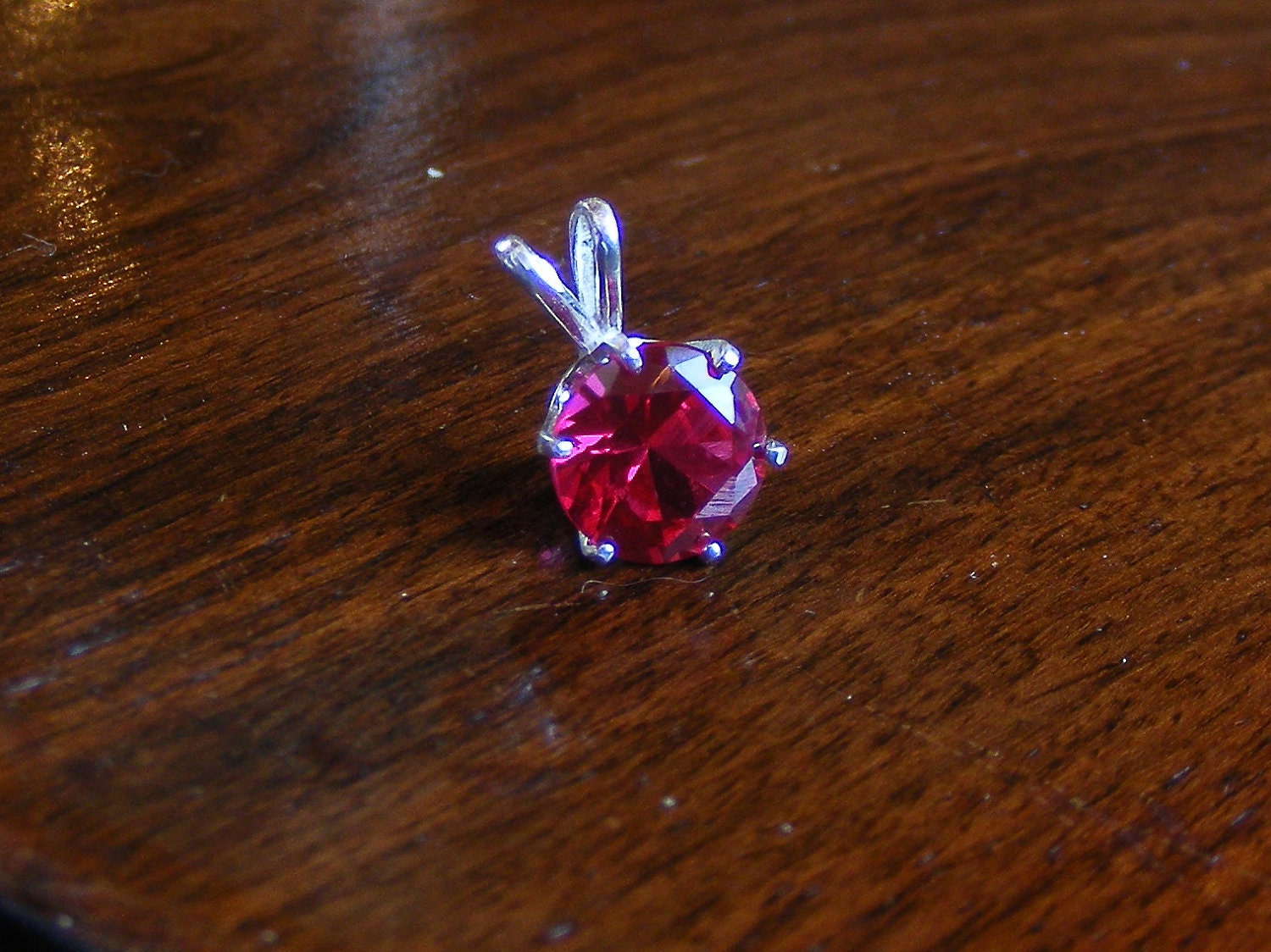 Rich ruby pendant in silver.