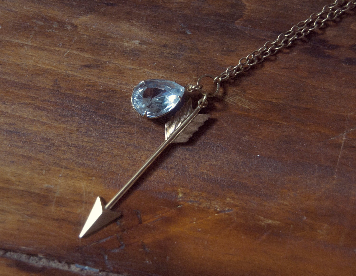 The Capture Necklace - arrow and vintage clear glass jewel on raw gold chain