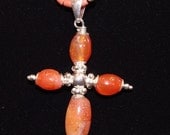 Carnelian and silver cross on carnelian and silver necklace.