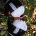 Hand knit Border Collie mittens gloves in black and white with polymer clay buttons