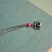 I heart my camera necklace.