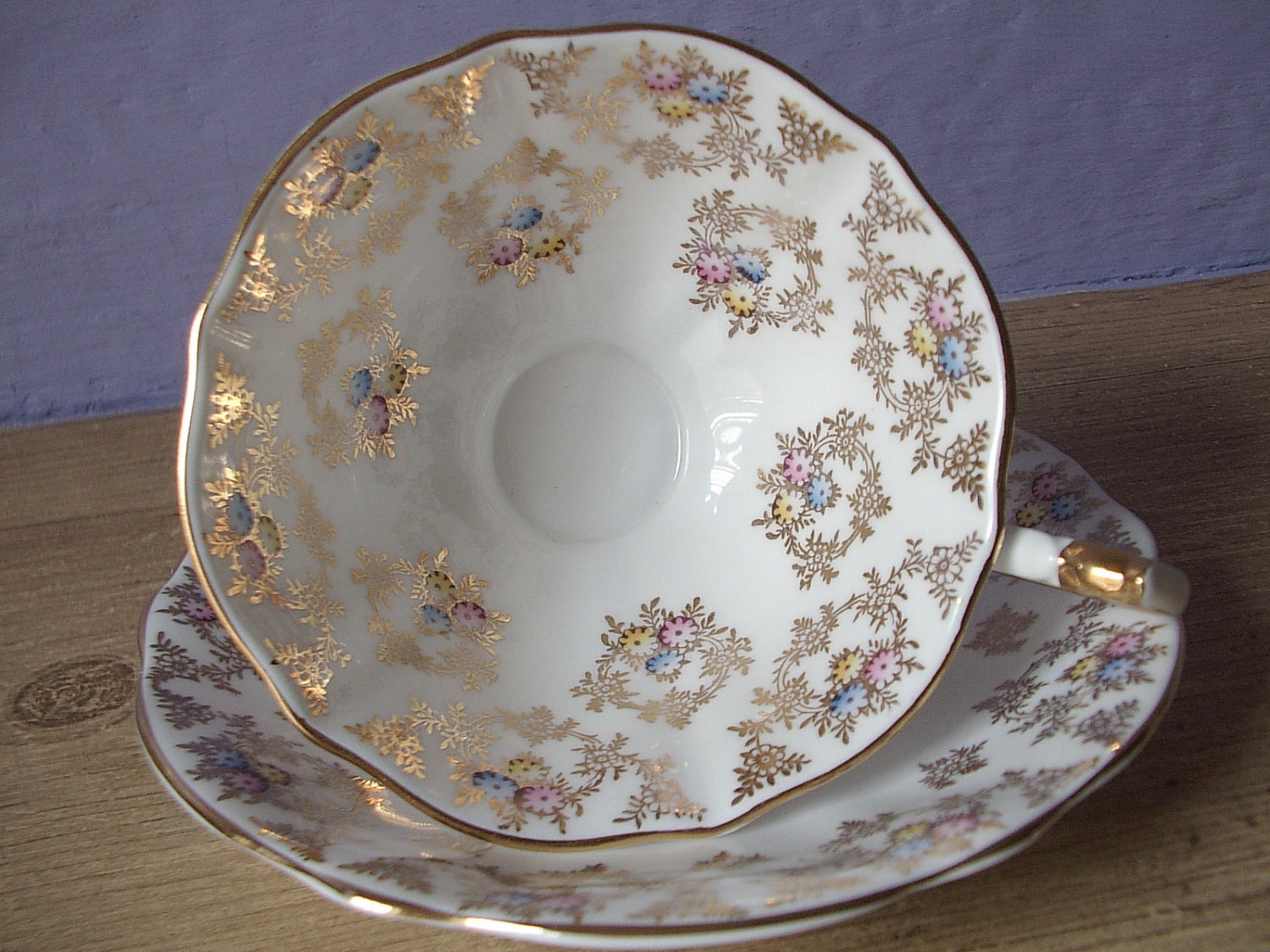 gold flowers tea cup and saucer set, Queen Anne, vintage English, hand painted bone china, pedestal, red blue yellow