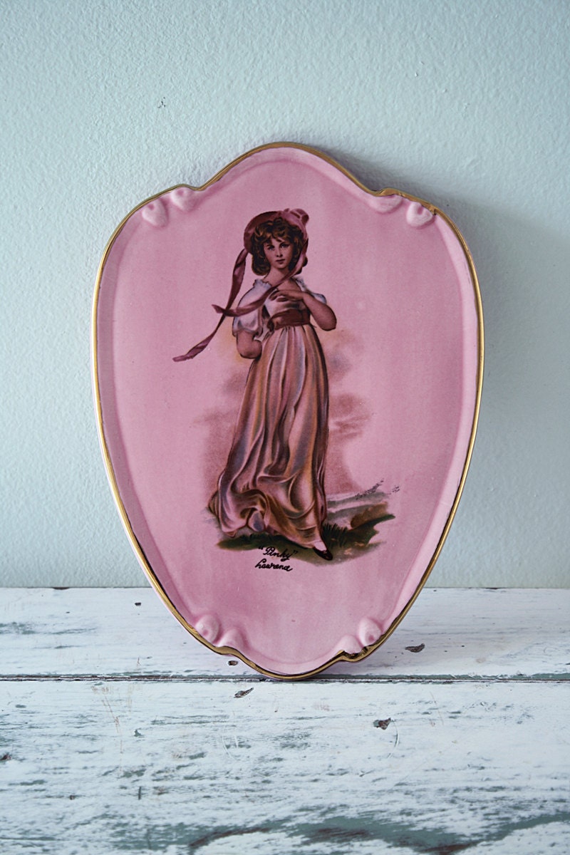 Gold rimmed pink ceramic lady wall plaque 1980's