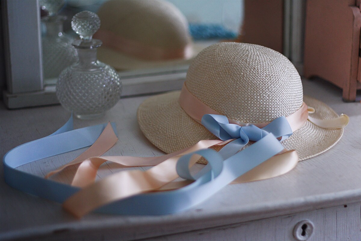 1960s spring straw hat with pink and blue ribbon