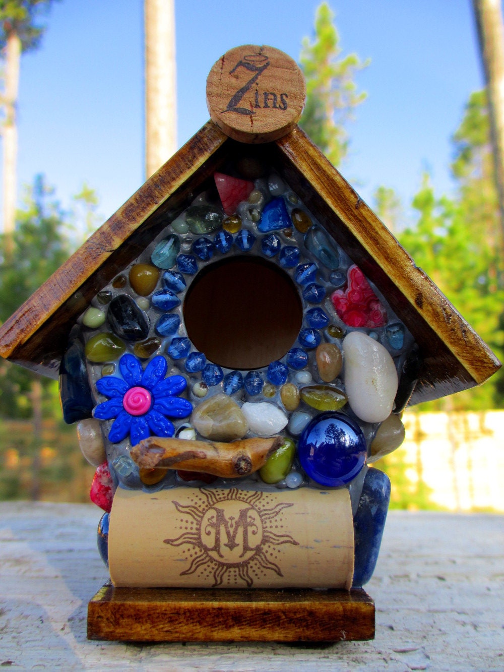 Whimsical garden birdhouse with Colorful Flowers and wine corks