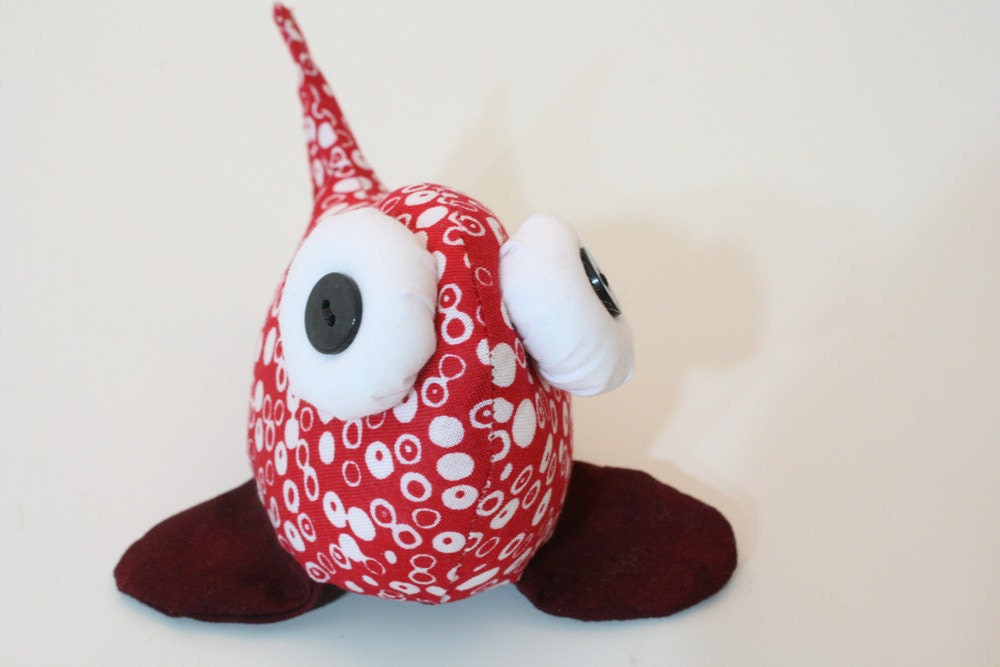 beady-eyed fish in red and white cotton print