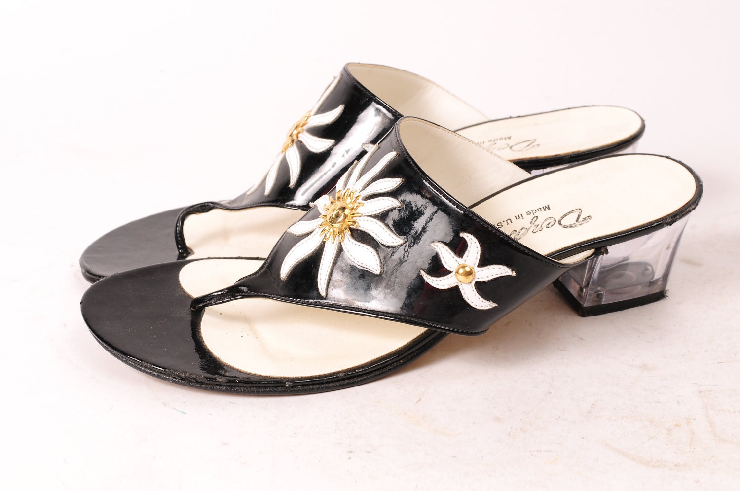 1980's Dezaria Black Patent Leather pumps - white sunburst design, gold sun and clear heels - Size 6