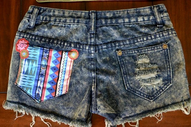 ripped jeans shorts with tribal patch