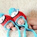 Then, out of the box came Thing 1 and Thing 2, Dr. Suess inspired pom pom beanie with earflaps and braided tassels- Newborn Twins