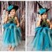 Witch tutu dress. Crocheted top and with peacock feathers and matching witch hat . flower and tulle embellishments