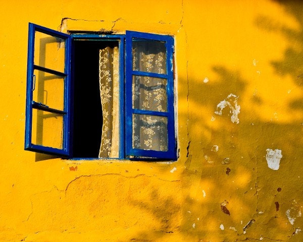 Mediterranean Summer - A Fine Art Photograph - A bright blue open window against a rustic yellow wall in Turkey