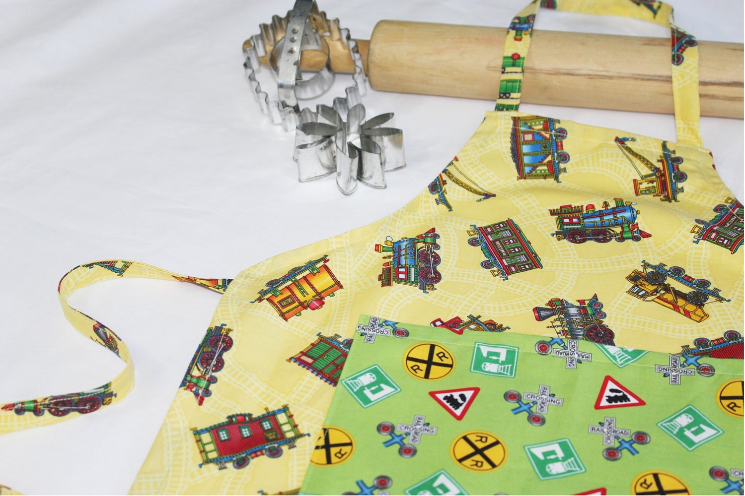 Trains Child Apron - yellow with green pocket