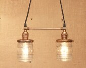 Chandelier Lighting with Twin Glass Shades and Antique Brass Spreader Bar and Black Twisted Wire