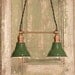Lighting with Twin Vintage Enamel Shades and Antique Brass Spreader Bar and Black Twisted Wire