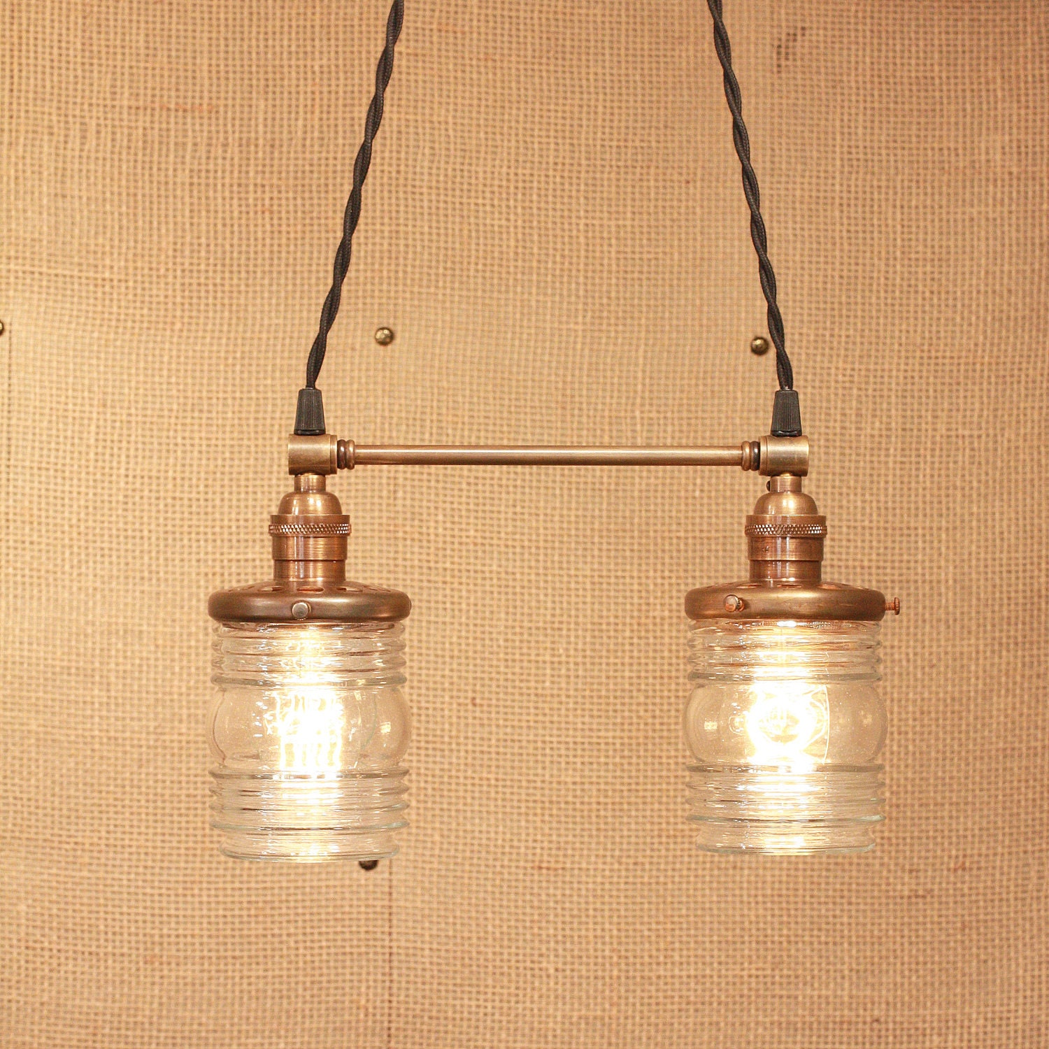 Chandelier Lighting with Twin Glass Shades and Antique Brass Spreader Bar and Black Twisted Wire