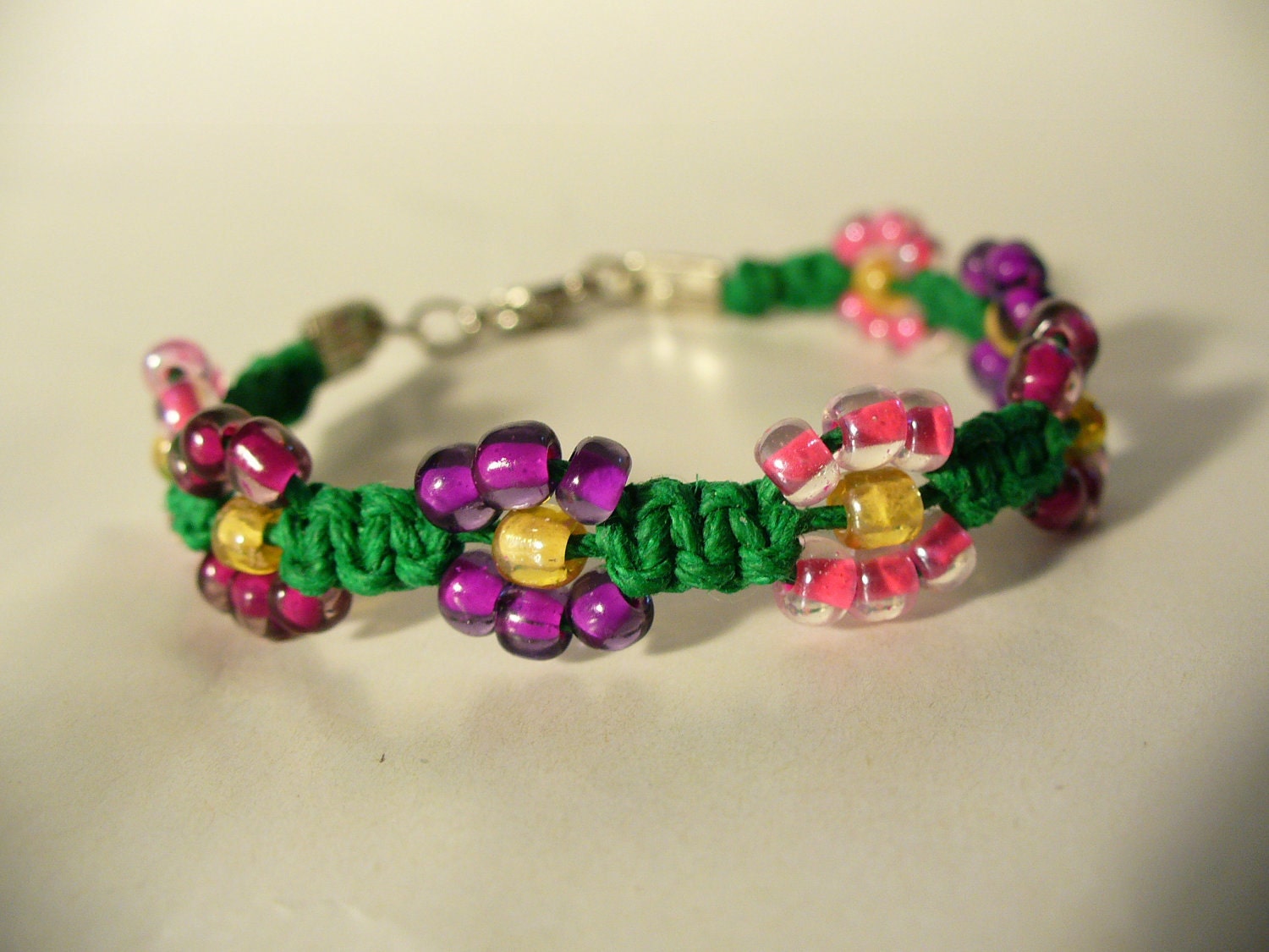 Hemp Jewelry Bracelet Hot Pink Royal Purple and Fuschia flowers on Green Free Shipping