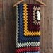 Colorful crocheted blanket, small square lap blanket