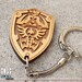 Laser cut and engraved Zelda Hylian Shield wood keyring