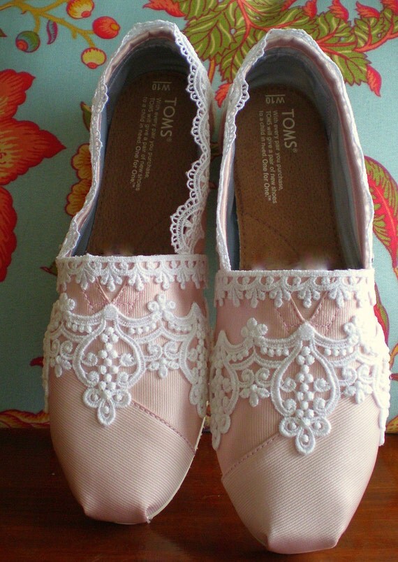 You are here What we love is that the price of a pair of Toms bridal shoes won’t make a huge dent in your wedding budget. That, and the delicate classic lace makes for a fantastic shoe shot. Hello — look at the gorgeous pics below! Toms also make a wonderful bridesmaid thank you gift.