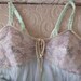 Vintage lingerie with bullet bra in minty green and lavender.