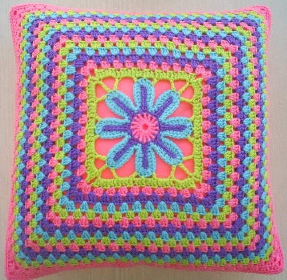 the flower in a granny square crochet cushion cover / pillow