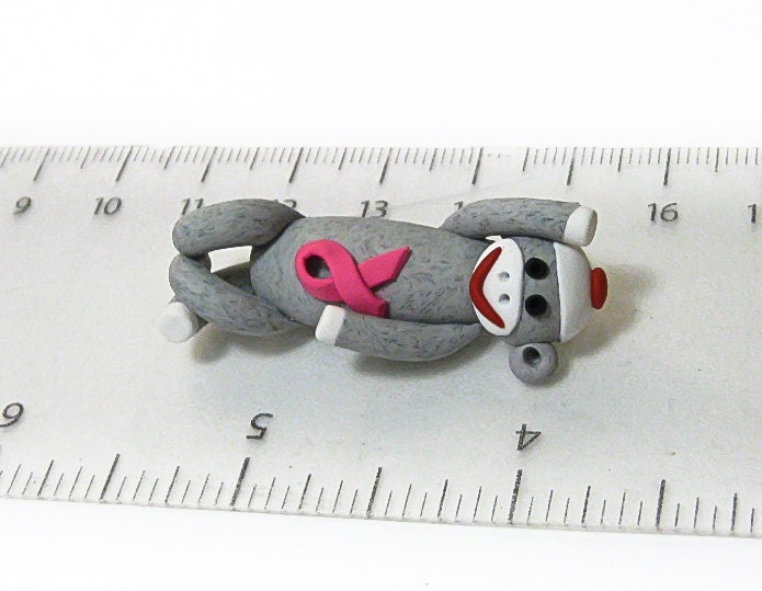 READY TO SHIP: Sock Monkey Pendant Clutching Pink Awareness Ribbon in Traditional Gray Polymer Clay