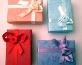 Add a gift box - red, blue, pink or purple
