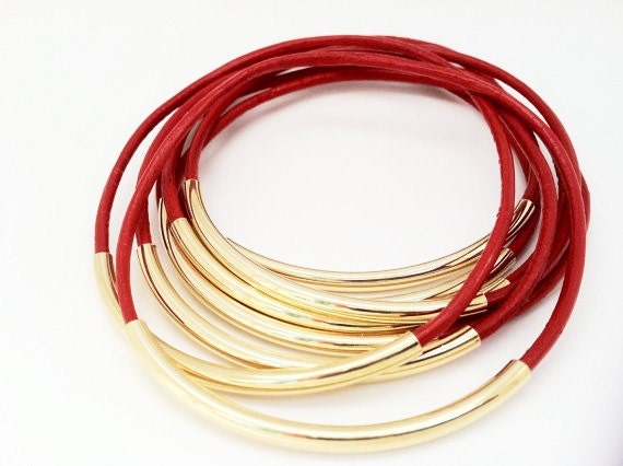 Red leather bangles with gold tubes