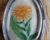 Oval Glass PAPERWEIGHTAntique Orange FLOWER Engraving on a Dictionary Book Page Background Very STRIKING