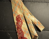 Beige silk necktie with red embroidery adornment
