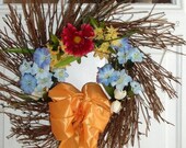 Floral Wreath, Grapevine Twig with Spring Flowers Accented with Orange Ribbon