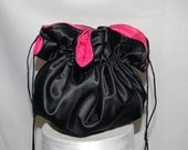 Round bag medium reversible shown in black and hot pink