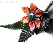 Grooms or groomsmen origami boutonniere in black, peach, and orange