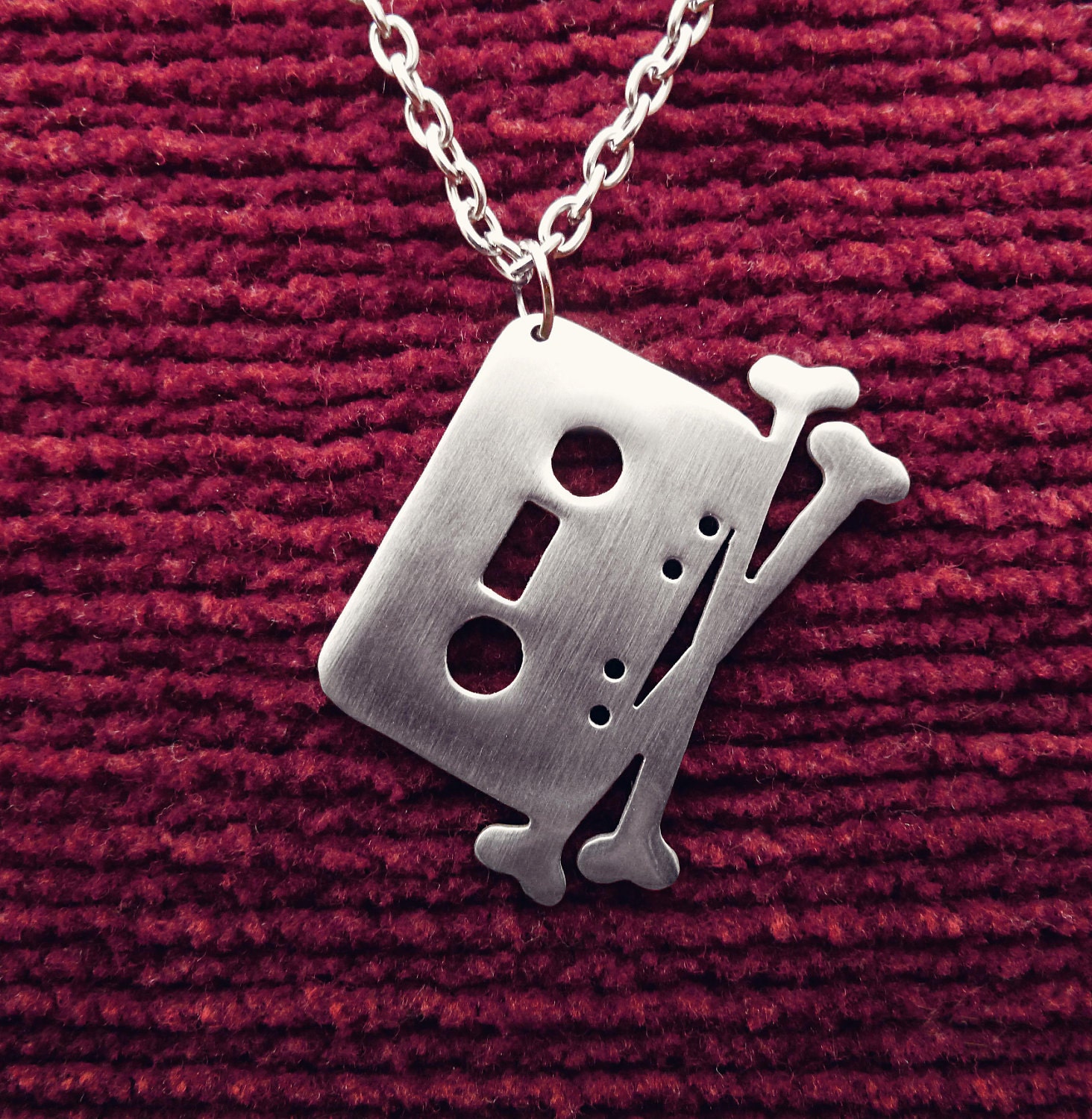Tape and Crossbones Pendant Necklace The Pirate Bay Cassette