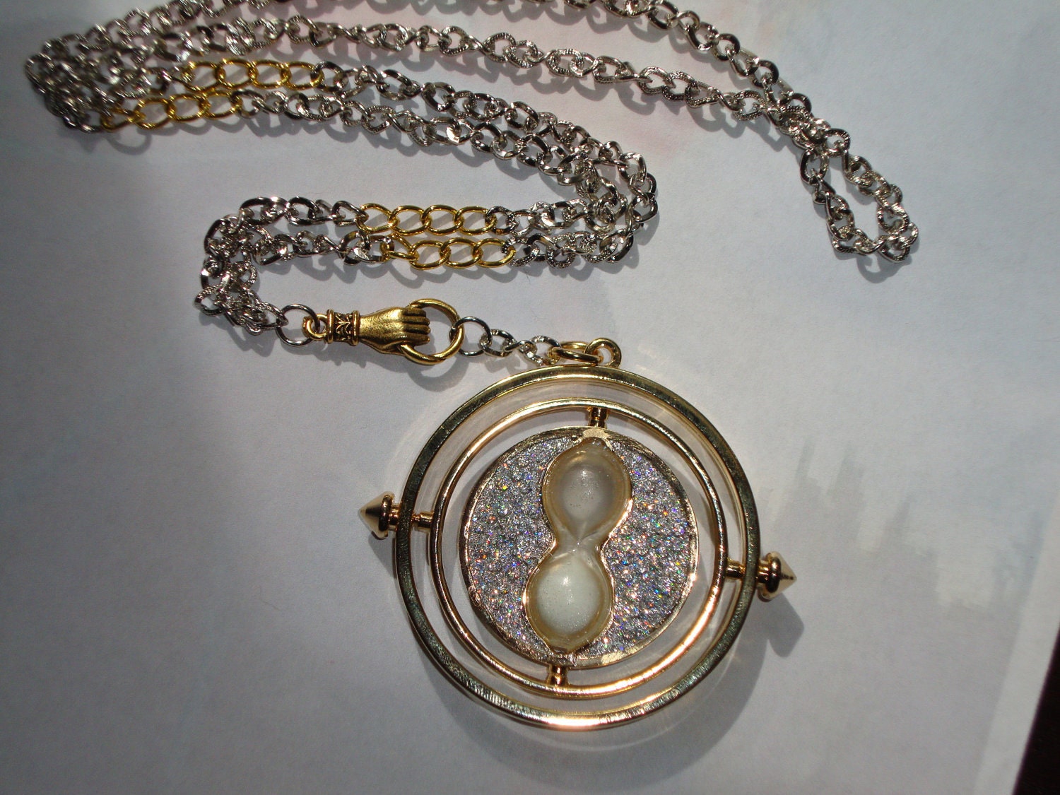 Harry Potter a Time Turner in Hand Necklace , Silver & Gold with Personalized Parchment Note (silver sparkly)