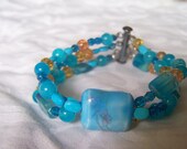 Turquoise, aqua, handmade beaded bracelet, hand painted porcelain focal bead  triple strand, amber accent, romantic,