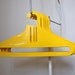 Set Of Five Vintage Yellow Coat Hangers