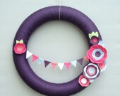 Purple Yarn Wreath. Pink, fuchsia, light blue and white felt flowers and felt bunting.  Great for girl's birthday party. 14" door wreath.