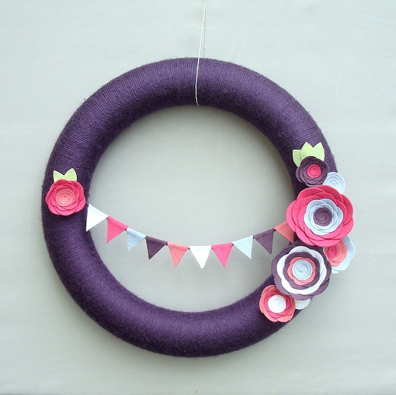 Purple Yarn Wreath. Pink, fuchsia, light blue and white felt flowers and felt bunting. Great for girl's birthday party. 14" door wreath.