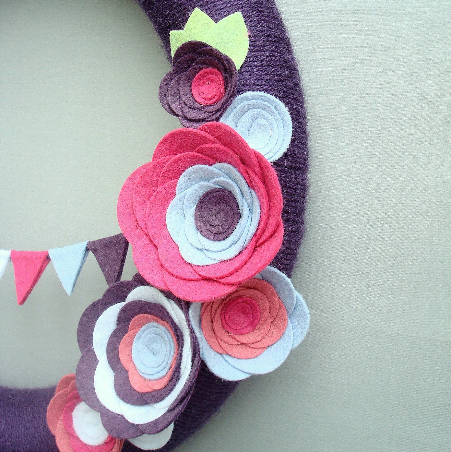 Purple Yarn Wreath. Pink, fuchsia, light blue and white felt flowers and felt bunting. Great for girl's birthday party. 14" door wreath.
