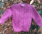 Girl's pink cable cardigan