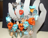 Shades of Turquoise and Orange Day of the Dead,Goth,Rockabilly,Halloween,Pirate Skull Charm Bracelet.