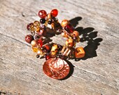 Knitted Copper Wire Bracelet With Brown Glass And Wodden Painted Beads With Two Copper Hand Stamped Charms